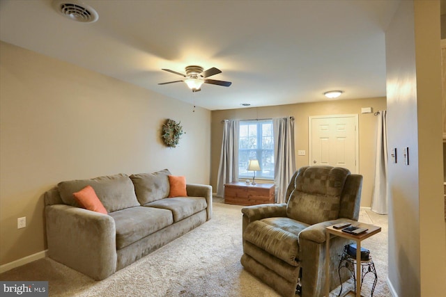 living room with ceiling fan and carpet floors