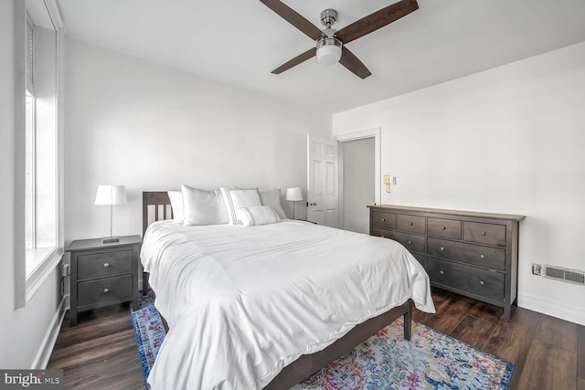 bedroom featuring dark hardwood / wood-style floors and ceiling fan