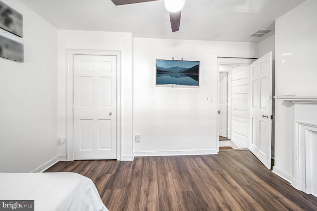 bedroom with ceiling fan and dark hardwood / wood-style floors