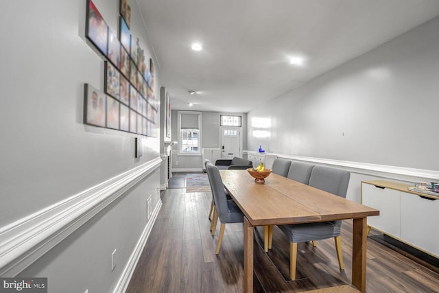 dining area with dark wood-type flooring