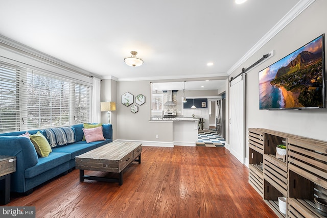 living room featuring crown molding, a barn door, and dark hardwood / wood-style floors