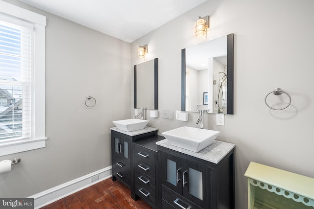 bathroom with hardwood / wood-style flooring and vanity