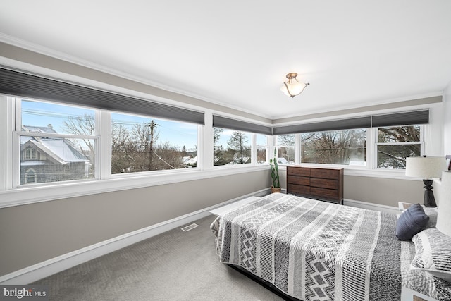 carpeted bedroom featuring ornamental molding