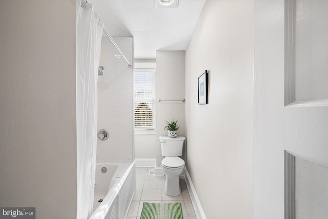 bathroom with shower / bath combo, tile patterned floors, and toilet