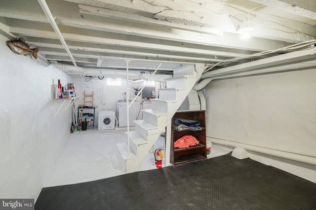 basement with washing machine and clothes dryer