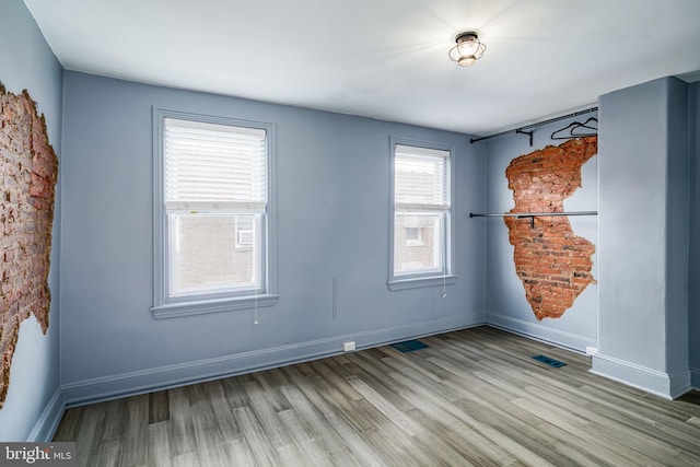 spare room featuring light wood-type flooring