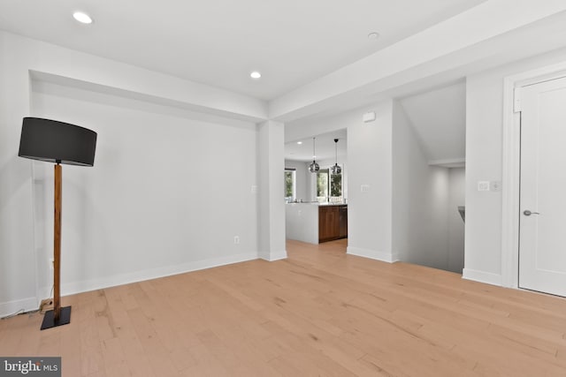 unfurnished living room with light wood-type flooring