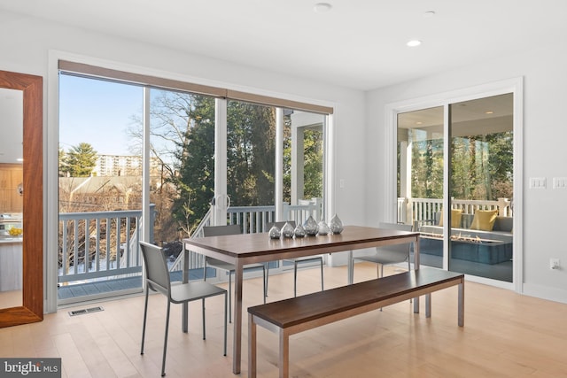 dining area with light wood-type flooring