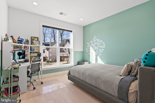 bedroom with light wood-type flooring