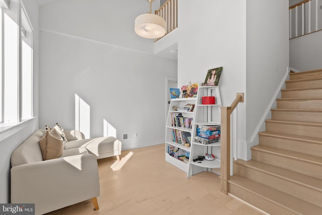 living room with light hardwood / wood-style flooring