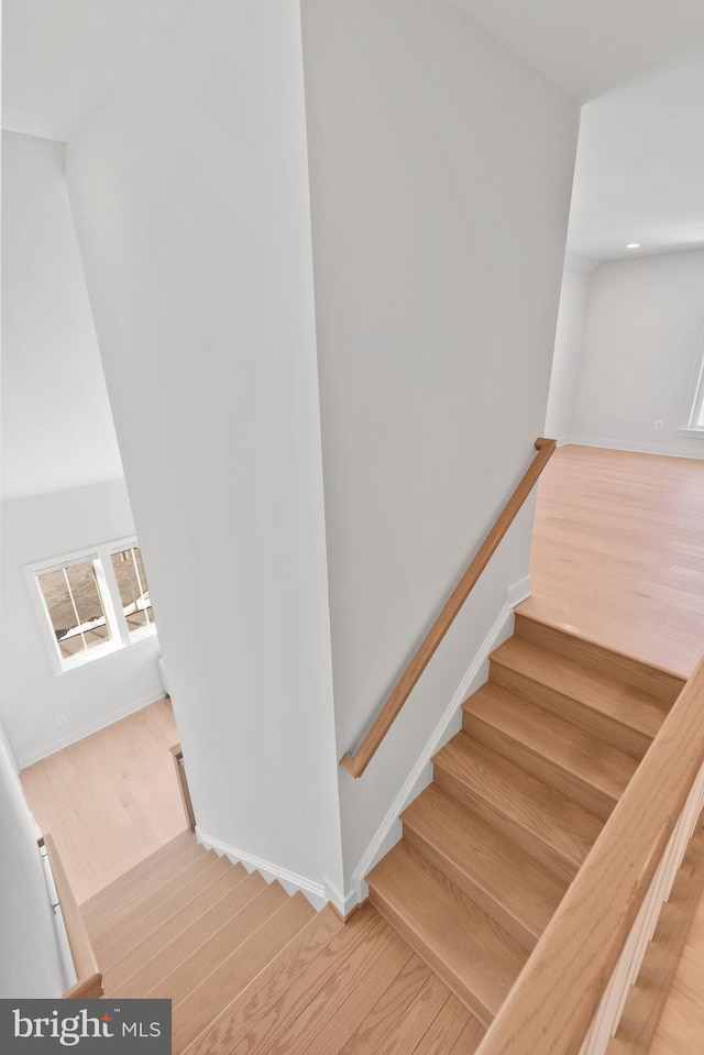 staircase featuring hardwood / wood-style floors