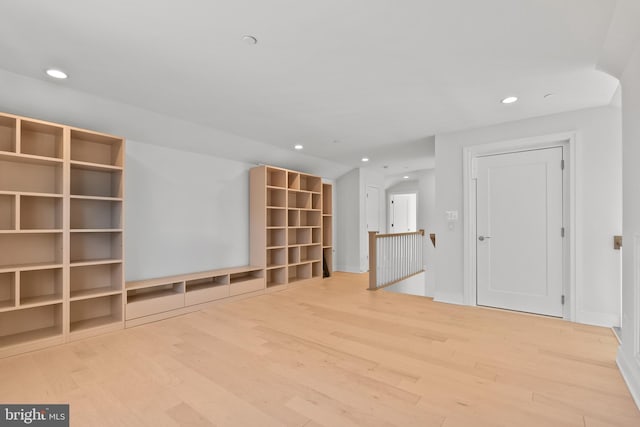 unfurnished living room with hardwood / wood-style flooring