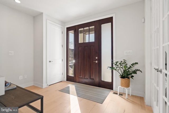 entrance foyer with light hardwood / wood-style floors