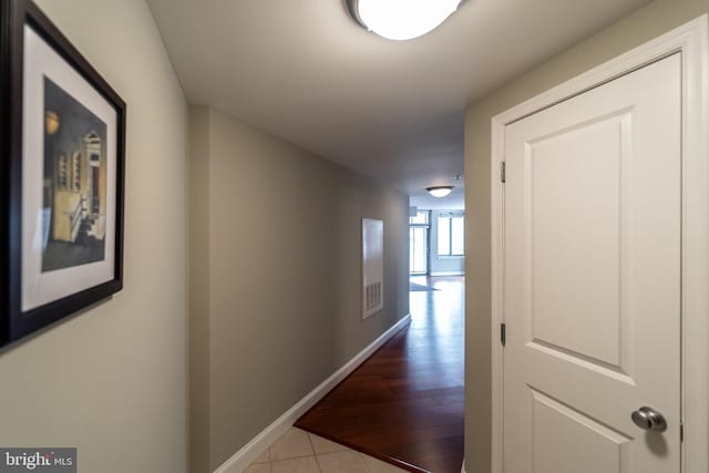 hall with light tile patterned flooring