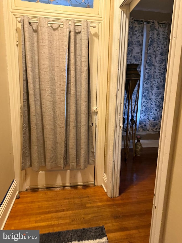 bathroom with hardwood / wood-style floors