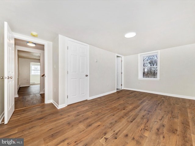 spare room featuring dark hardwood / wood-style flooring