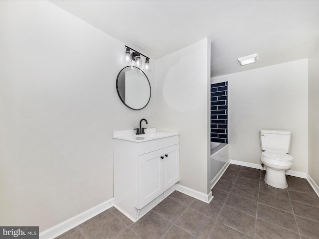 bathroom featuring vanity, toilet, and tile patterned flooring