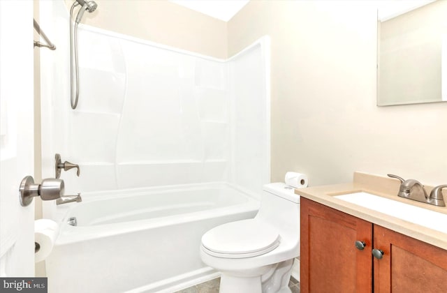 bathroom with shower / bathing tub combination, vanity, and toilet