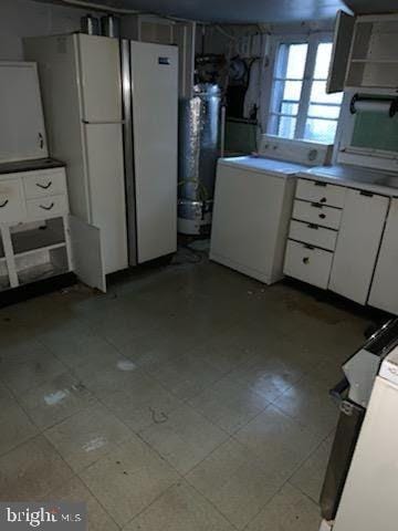 interior space featuring refrigerator and white fridge