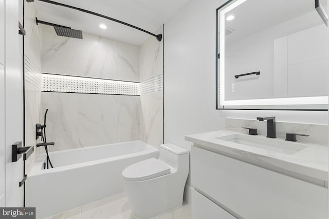 full bathroom with vanity, toilet, and tiled shower / bath