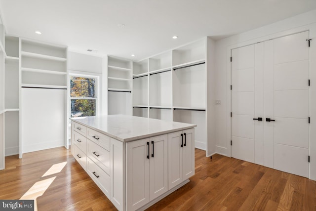 walk in closet featuring light hardwood / wood-style floors