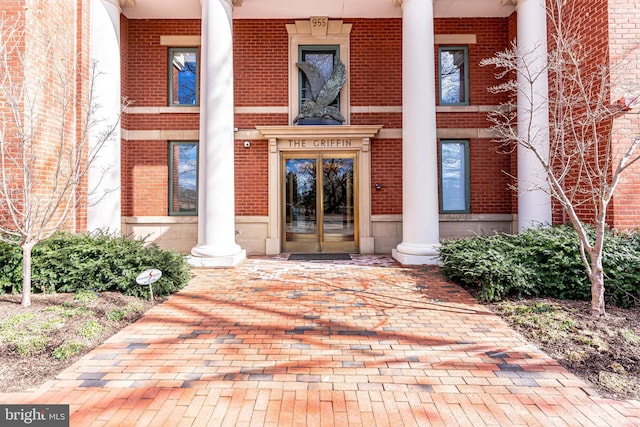 view of exterior entry featuring french doors