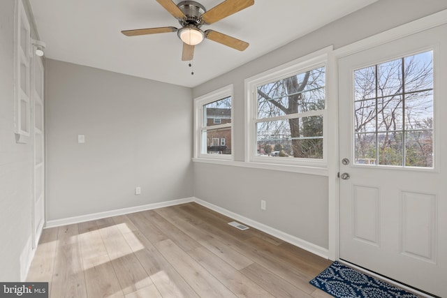 interior space with ceiling fan and light wood-type flooring