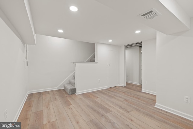 basement featuring light hardwood / wood-style floors