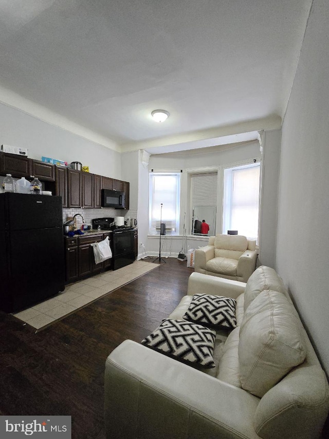 living room with light hardwood / wood-style flooring