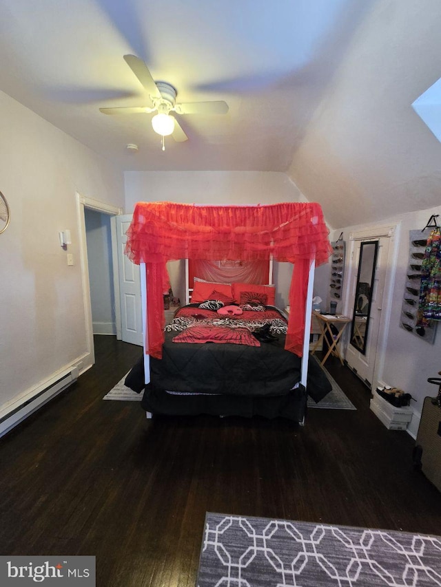 bedroom with a baseboard heating unit, vaulted ceiling, dark wood-type flooring, and ceiling fan