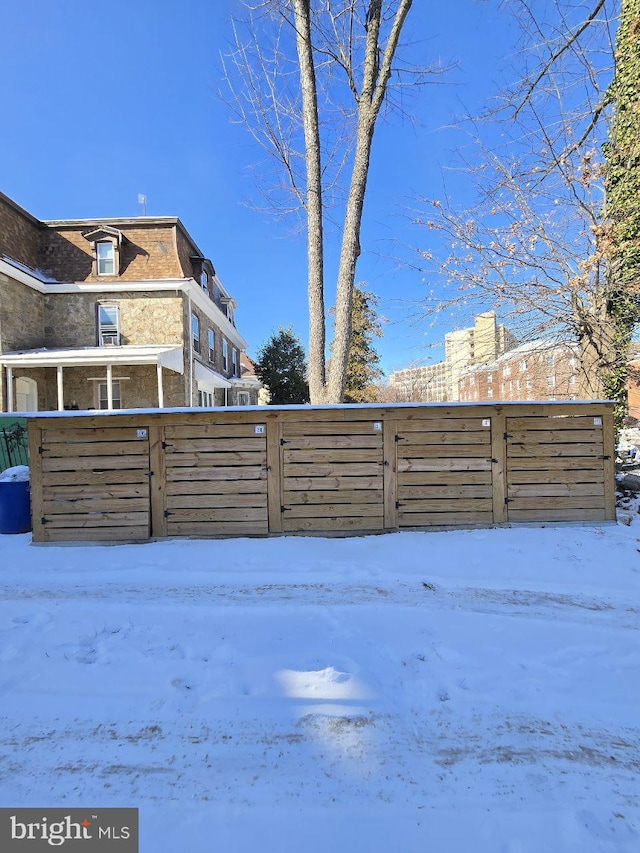 view of yard layered in snow