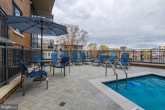 view of swimming pool featuring a pool and a patio