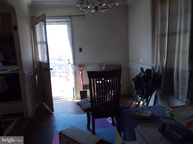 dining area with an inviting chandelier and wood-type flooring