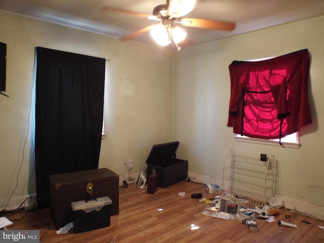 bedroom featuring hardwood / wood-style floors and ceiling fan