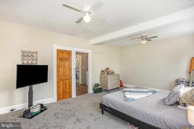 carpeted bedroom featuring a ceiling fan, beam ceiling, a textured ceiling, and baseboards