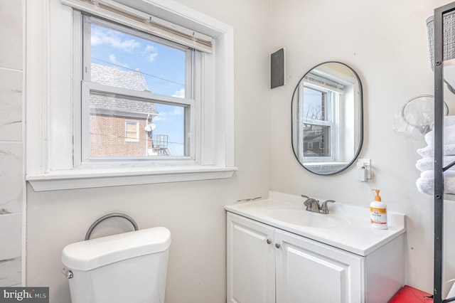 bathroom featuring vanity and toilet