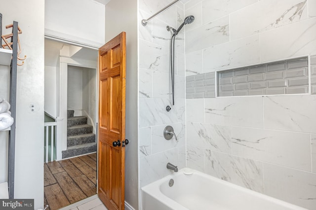 bathroom with tub / shower combination and wood finished floors