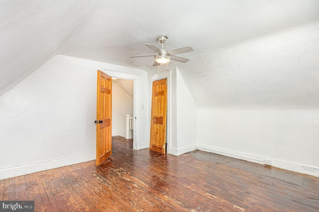 bonus room with a ceiling fan, baseboards, vaulted ceiling, and hardwood / wood-style floors