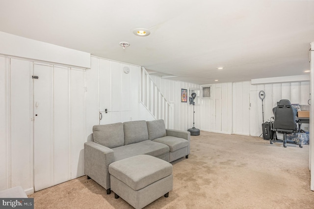 carpeted living room featuring stairway