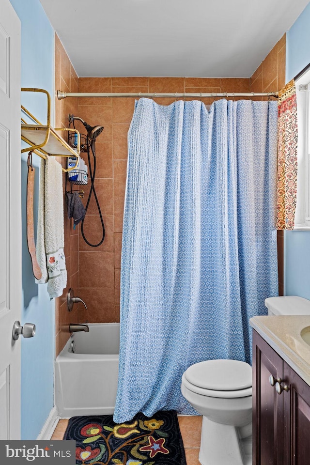 bathroom with tile patterned floors, toilet, and vanity