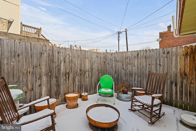 view of patio featuring a fire pit