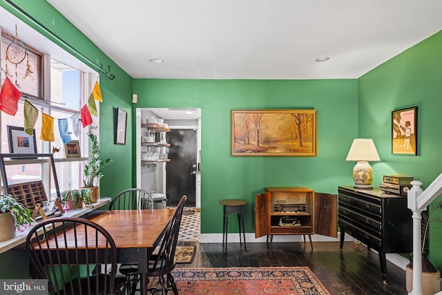 dining area featuring dark hardwood / wood-style flooring