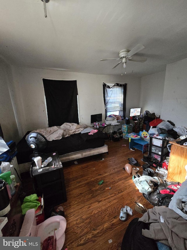 bedroom with dark wood-type flooring and ceiling fan