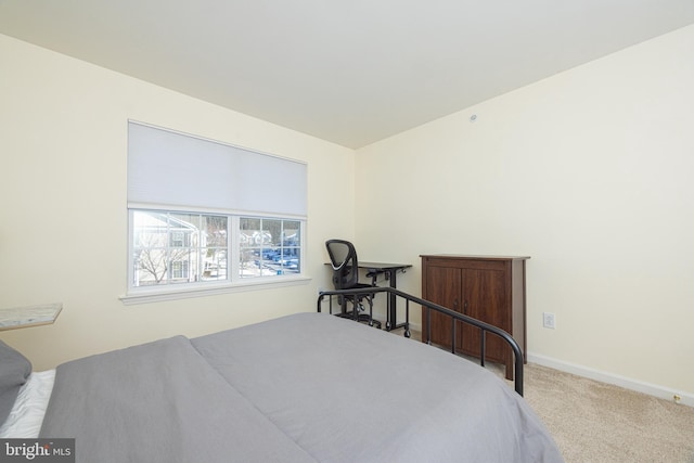 bedroom with light colored carpet