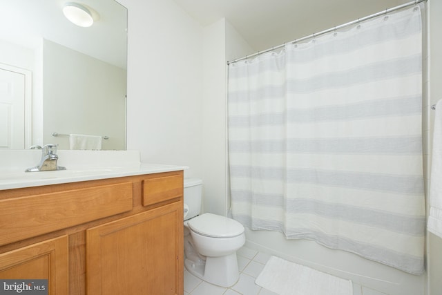 full bathroom featuring vanity, tile patterned floors, shower / bath combo with shower curtain, and toilet