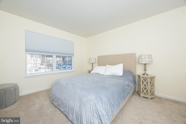 bedroom with light carpet