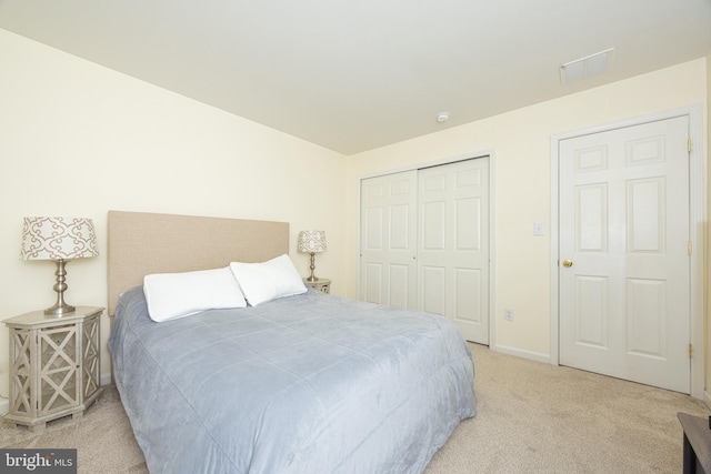 carpeted bedroom with a closet