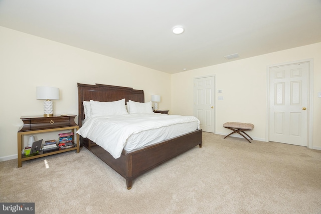 bedroom with light carpet