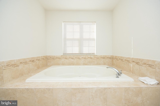 bathroom featuring tiled bath