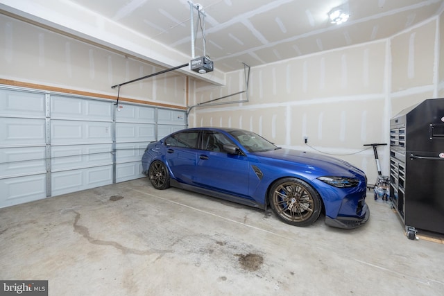 garage featuring a garage door opener